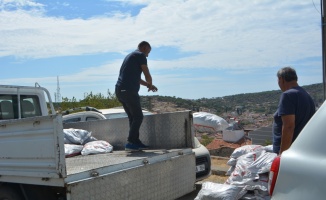 Ayvalık'ta ihtiyaç sahiplerine 15 ton kömür dağıtıldı